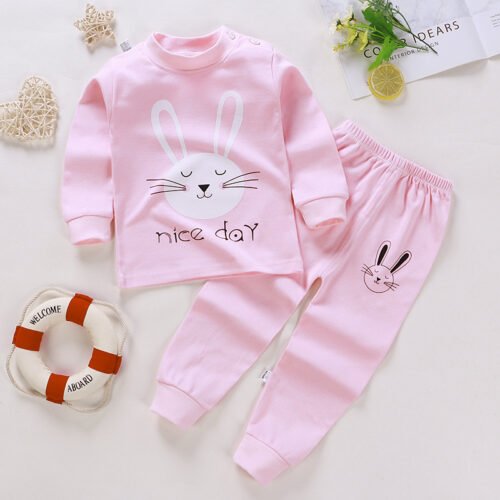 Kinderpyjama, konijn gezicht met "Nice Day" op roze shirt